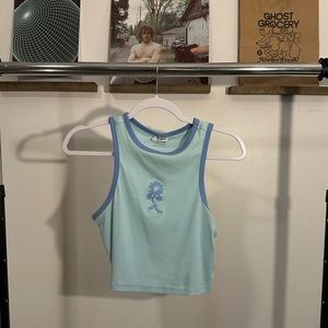 Blue top with sunflower stitch
